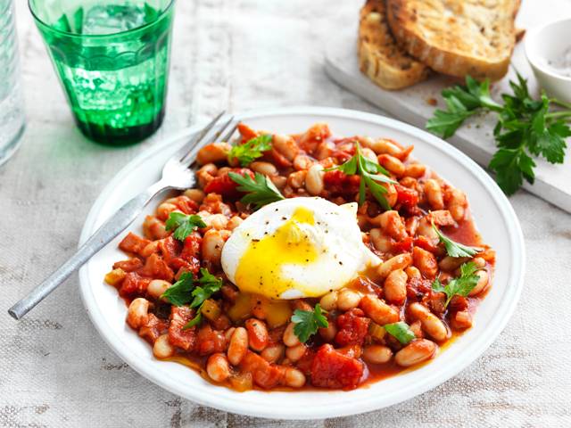 Smoky baked beans with poached eggs and chive oil